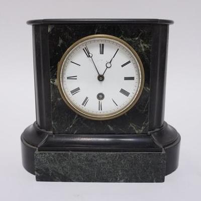 1012	ANTIQUE DIMINUTATIVE MARBLE MANTLE CLOCK  WITH REEDED COLUMNS. 7 1/4 IN HIGH, 8 1/4 IN WIDE AND 4 3/4 IN DEEP.
