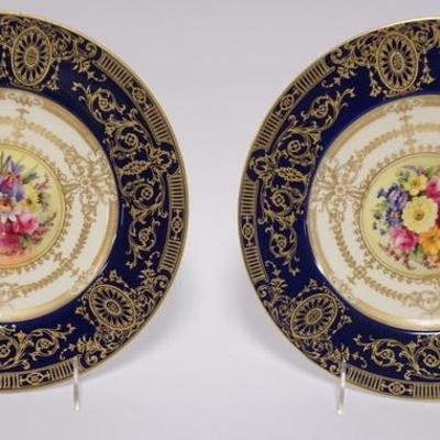 1008	PAIR OF ROYAL WORCESTER SERVICE PLATES WITH ELABORATE COBALT BLUE AND GOLD BORDERS AND COLORFUL FLORAL CENTERS. 10 1/2 IN

