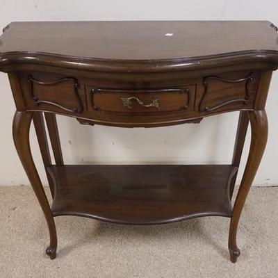 1064	MAHOGANY FLIP TOP GAME TABLE, HAS ONE DRAWER & A FELT SURFACE W/ GILT LEATHER TRIM, HINGE FOR EXTENSION LEG IS BROKEN
