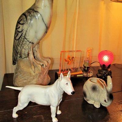 Stone carved hawk and Royal Doulton bull terrier