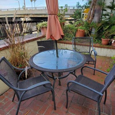 Glass Top Wicker Patio Table with 4 Chairs
Table measures approx 44" x 27" 