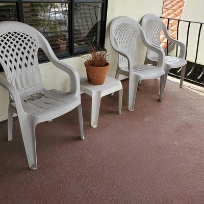3 White Plastic Chairs, End Table and Pottery
3 White Plastic Patio furniture and Pot6