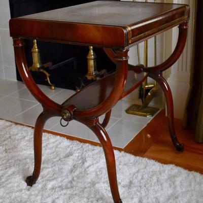One of a pair of leather top side tables
