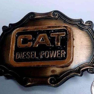 https://www.ebay.com/itm/124143286943	AB0007 USED VINTAGE CAT DIESEL POWER BRONZE BELT BUCKLE $10.00 RAINTREE 1978 RECTANGLE shape BOX 74...