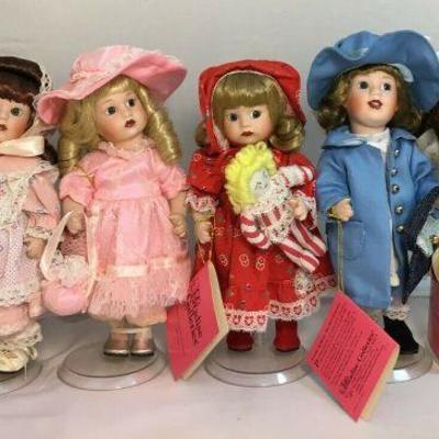 https://www.ebay.com/itm/124162065771	BR007: Paradise Galleries Days Of The Week Porcelain Doll Collection With Doll Stands And...