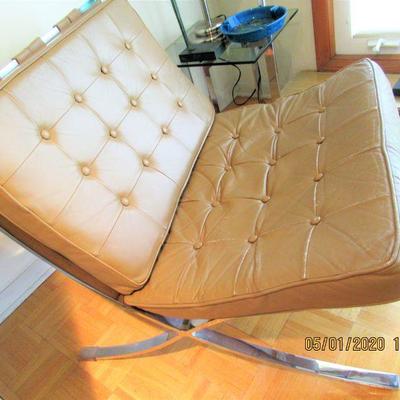 $ 1,200.00  BARCELONA CHAIR, TAN/CAMEL LEATHER and CHROME  The Barcelona Chair is 29.5” (74.9 cm) wide, 30” (76.2 cm) deep, with a back...