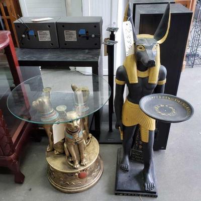 2335	
1 Egyptian Glass End Table, 1 Egyptian Statue
Measurements Include 18.5"(L)Ã—20.5"(H)Ã—18.5"(W),...