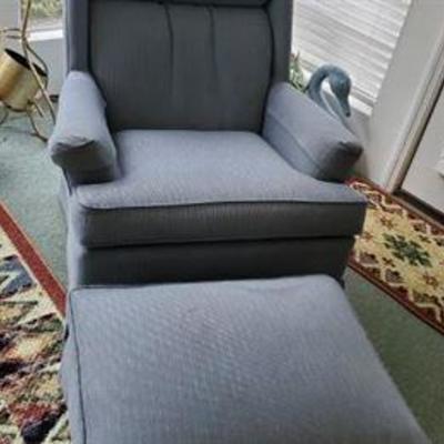 Blue upholstered chair with ottoman. $85.00 