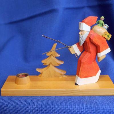 Lot 232: GDR Carved Santa Candleholder; Sticks are broken  $25