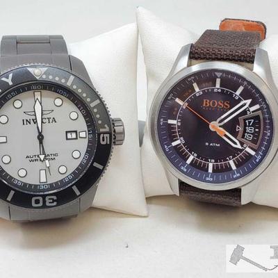 757	

Two Invicta Watches
Includes silver Grand Diver Invicta watch, black Invicta watch