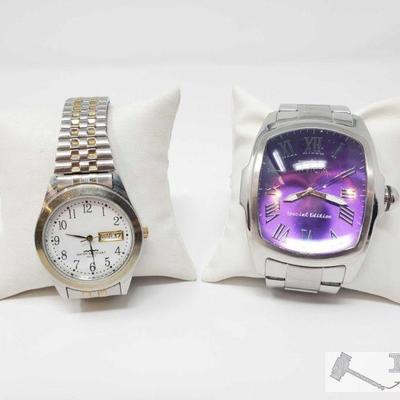 Two Silver Watches
Includes silver Special Edition Invicta watch with purple face, silver watch with gold accents