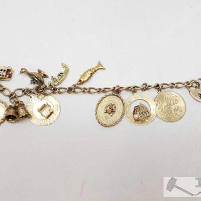 665	

9k Gold Bracelet W/ 14k, 10k, & 9k Charms.
Bracelet And Charms Together Weigh Approx 36.2g. Measures Approx 7