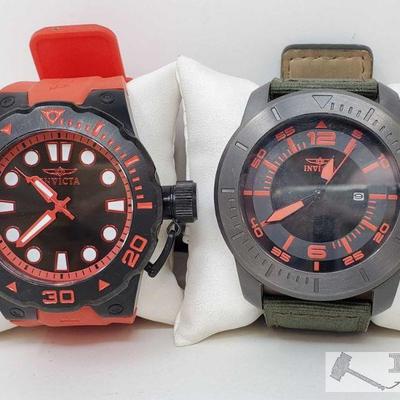 755	

Set of Two Invicta Watches
Includes red and black Invicta watch, black and green Invicta watch