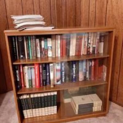 Book shelf with glass doors and contents - in basement