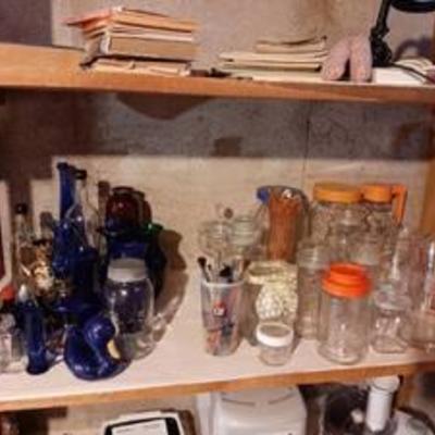 Contents of shelves - blue glass and pitchers - bring boxes