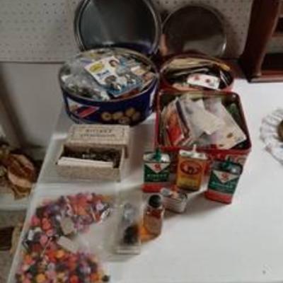 Assorted sewing items - buttons and oil