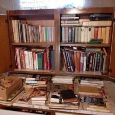 All books in cabinet and on counter - bring boxes - in basement
