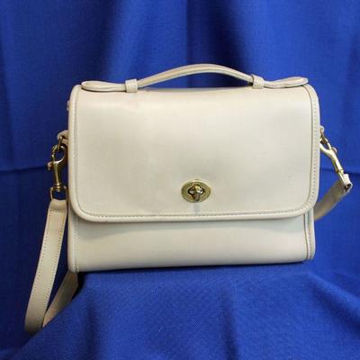 Lot 306: Ivory Coach Purse ; slight soiling on top and bottom 9 1/2 x 7 x 3 7/8     25