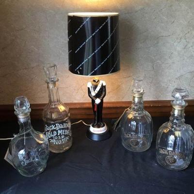 4 Jack Daniels Bottles and a Liquore Galliano Lamp