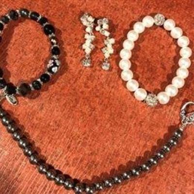 D # 5 $25 One pair of earrings and 3 bracelets lot. 