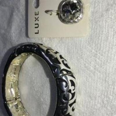 J#35 Stretch silver tone bracelet & a pair of earrings $25. 