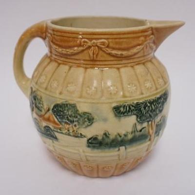 1056	ROSEVILLE POTTERY EARLY WARE LANDSCAPE PITCHER. 7 IN HIGH