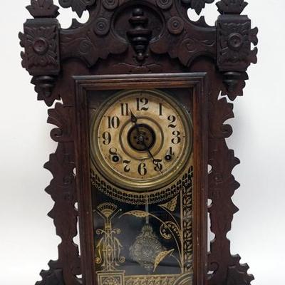 1007	ANTIQUE GINGERBREAD KITCHEN CLOCK. 24 1/2 IN. HIGH.