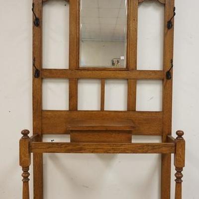 1066	OAK HALL RACK WITH LIFT TOP CENTER COMPARTMENT AND BEVELED MIRROR