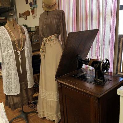 Minnesota sewing machine in cabinet. Two dressmakers forms