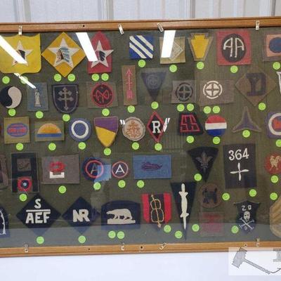 7810: 50 Military Patches in Wood Frame.Approx 50 Military Patches. Frame Measures Approx 36