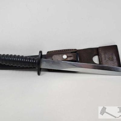 2308	

Blade w/ Sheath
Blade stamped with characters, W 630179. Measures 9.5