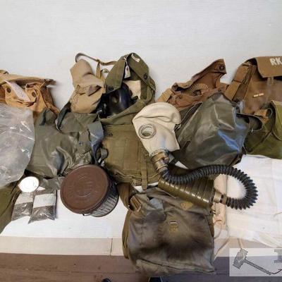 7103	

Gas Masks and Bags
World War circa gas masks. Satchels containing gas masks.