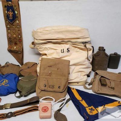7104	

Boy Scout Canteens and Gear
Boy scouts of America sash and handkerchief, canteens and pots, belts. Military bags.
