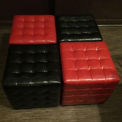 There are a total of 13 red and black leather ottomans. 5 black, 8 red. Priced separately.