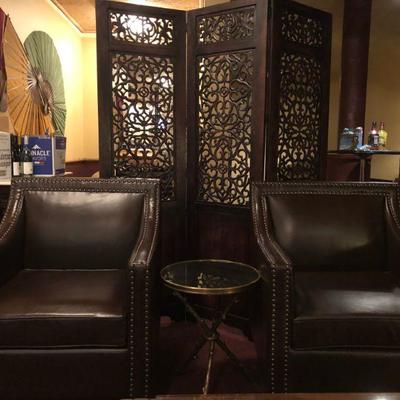 2 Dark Chocolate Leather Arm Chairs with  Nail-head trim. Excellent Condition. (The partition/screen behind the chairs is Not For Sale.)...