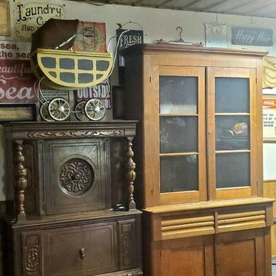 1870 pecan step back cabinet with wavy glass
