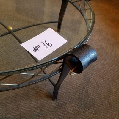 #16 ~ ($200) Close up of Glass top coffee table with iron frame and legs, brass accents.- 41