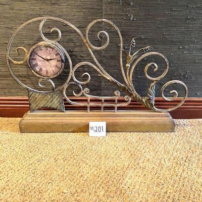 #201 ($60) large mantel or tabletop clock made of metal. Battery operated. 20