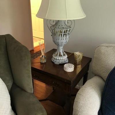 End table with one of two lamps
