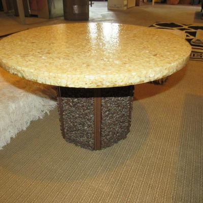 Cool vintage cocktail table- the base is covered in rock