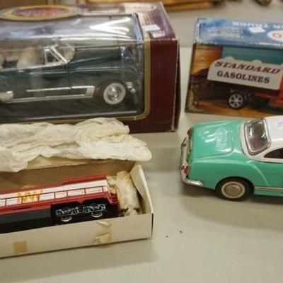 1038	TOY LOT 4 PC, COUPE DEVILLE, ESSO TRUCK, FRICTION CAR, AND HO GAUGE TRAIN ENGINE
