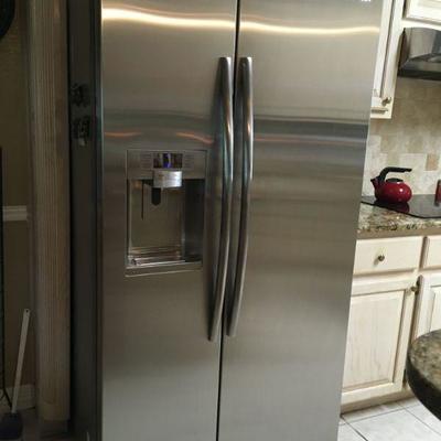 Samsung stainless steel refrigerator with in-door amenities