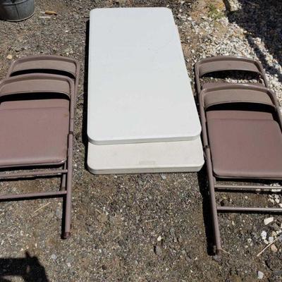 17101	

Two 4 Foot Plastic Folding Tables and 4 Metal Folding Chairs
Two 4 Foot Plastic Folding Tables and 4 Metal Folding Chairs
