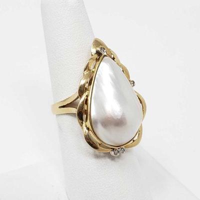 628	

14k Gold Ring With Center Pearl And Accent Diamonds, 6.7g
Size 7¹/². Diamonds Approx 1/64 ct.