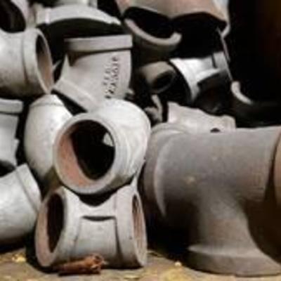 Bin of Elbow and T Pipe Fittings