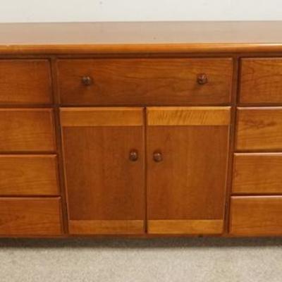 1220	THOMASVILLE CHEST OF DRAWERS. HAS 9 DRAWERS ANND 2 DOORS WITH INTERIOR DRAWERS. 74 IN WIDE
