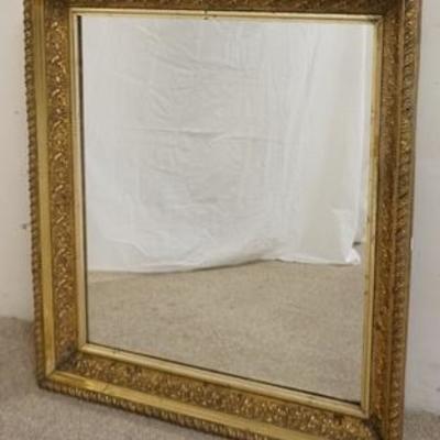 1289	MIRROR IN AN ORNATE GILT FRAME, WIRED TO HANG VERTICAL OR HORIZONTAL OVERALL DIMENSIONS 28 1/2 IN X 33 IN 
