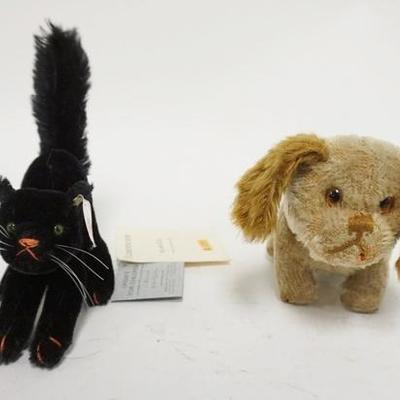 1317	STEIFF SCAREY CAT & A STUFFED DOG W/ MOVABLE HEAD & TAIL, DOG IS 7 1/2 IN L 
