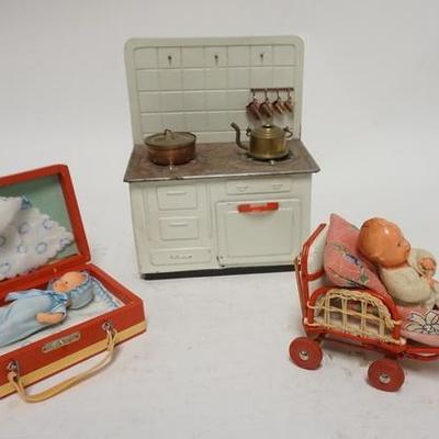 1301	THREE PIECE DOLL & TOY LOT, TIN TOY STOVE BY D.B.P, BABY DOLL IN A STROLLER, & BABY DOLL IN SUITCASE
