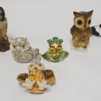 1179	A CERAMIC NIGHTLIGHT, TWO CERAMIC FIGURES, A CARVED STONE FIGURE (CHIP ON ONE EAR) & A STUFFED ANIMAL

